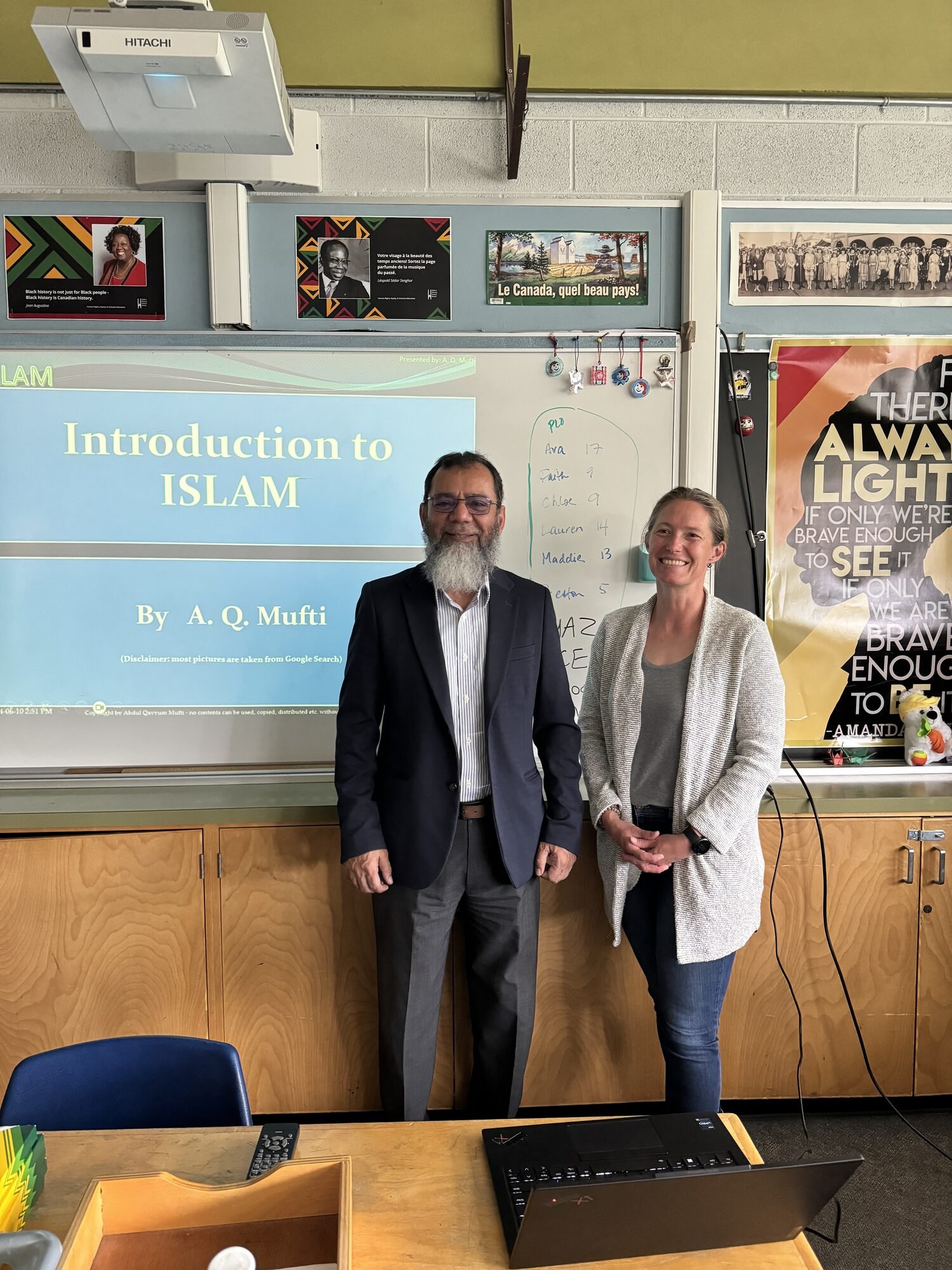 A Council member presenting an Introduction to Islam session to students in a school library.